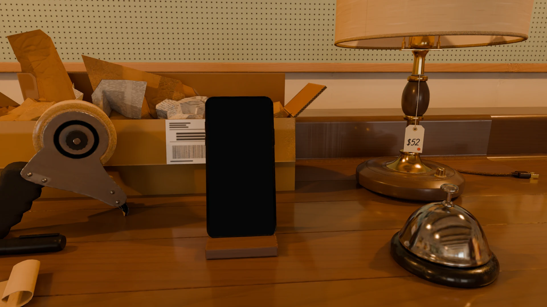 The shop counter: the lamp with its $52 price tag, a service bell and a packed shipping box